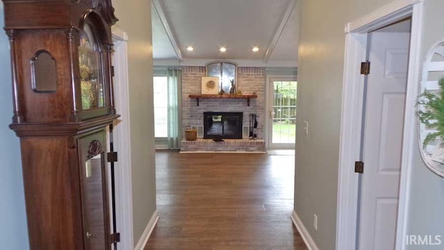 hallway with dark wood finished floors, baseboards, recessed lighting, and ornamental molding
