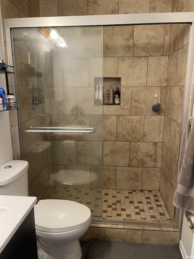 full bath featuring toilet and a shower stall