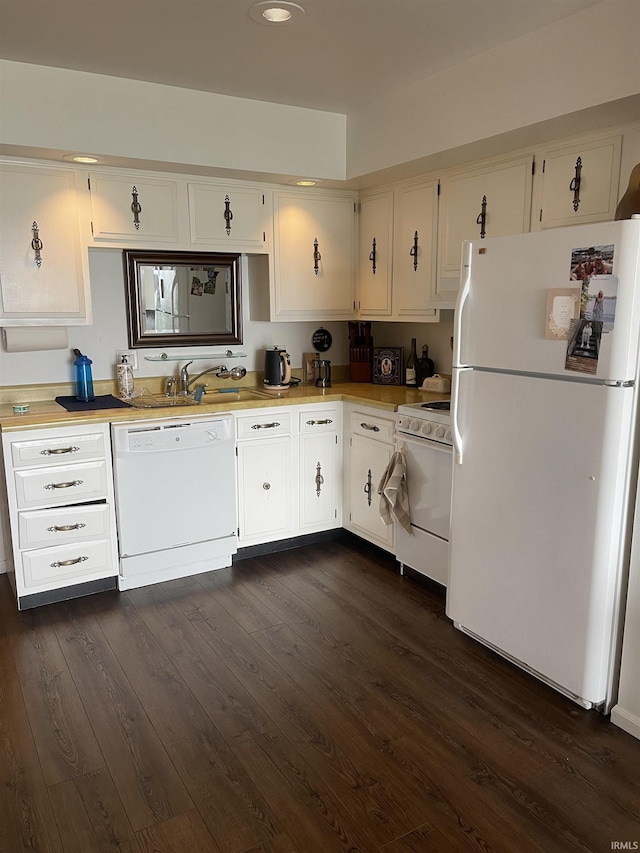 kitchen with white appliances, dark wood-type flooring, light countertops, and recessed lighting