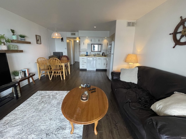 living area featuring dark wood-style flooring