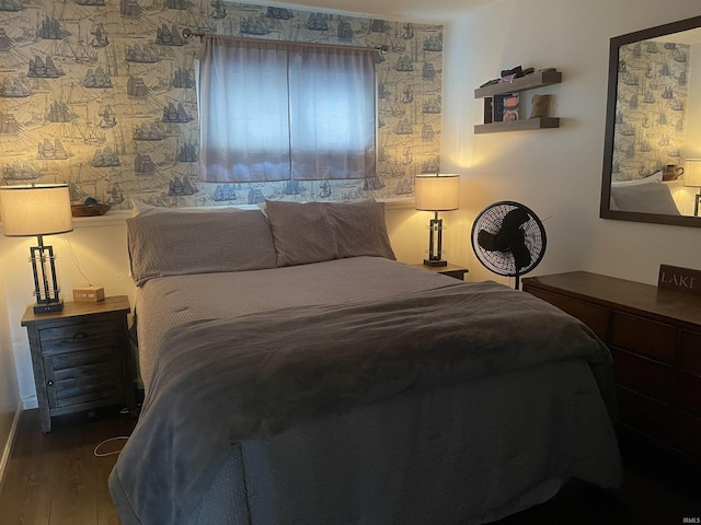 bedroom with wood finished floors