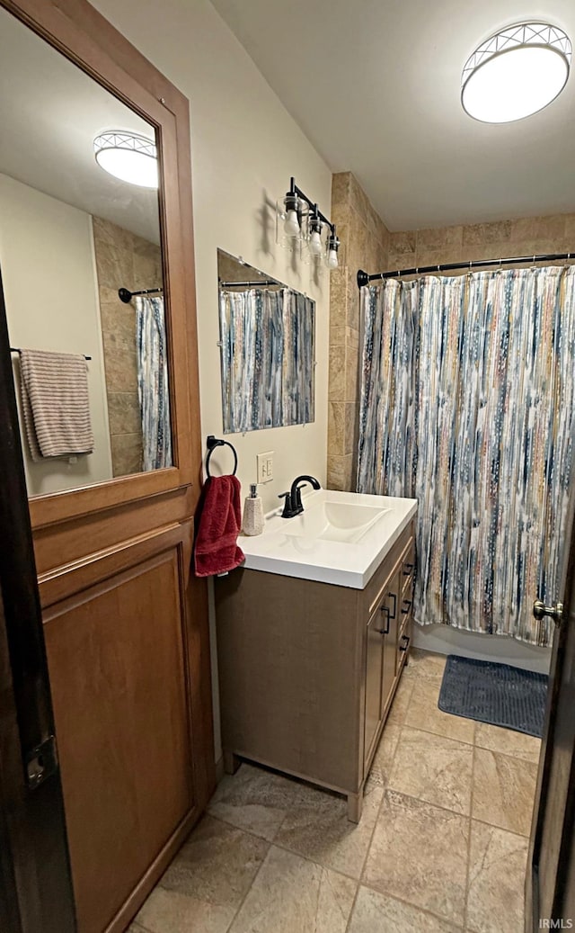 110 W Elnora St, Odon, IN 47562 - full bath with vanity, shower / bathtub combination with curtain, and stone finish flooring