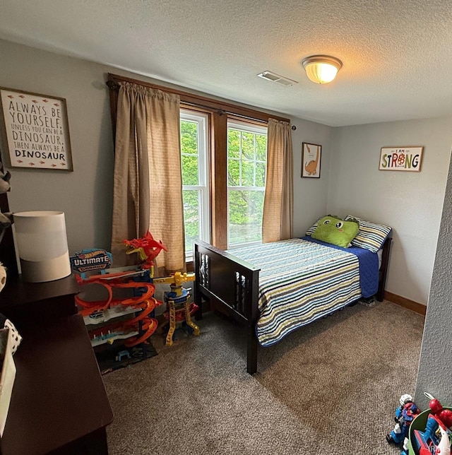 110 W Elnora St, Odon, IN 47562 - carpeted bedroom with a textured ceiling
