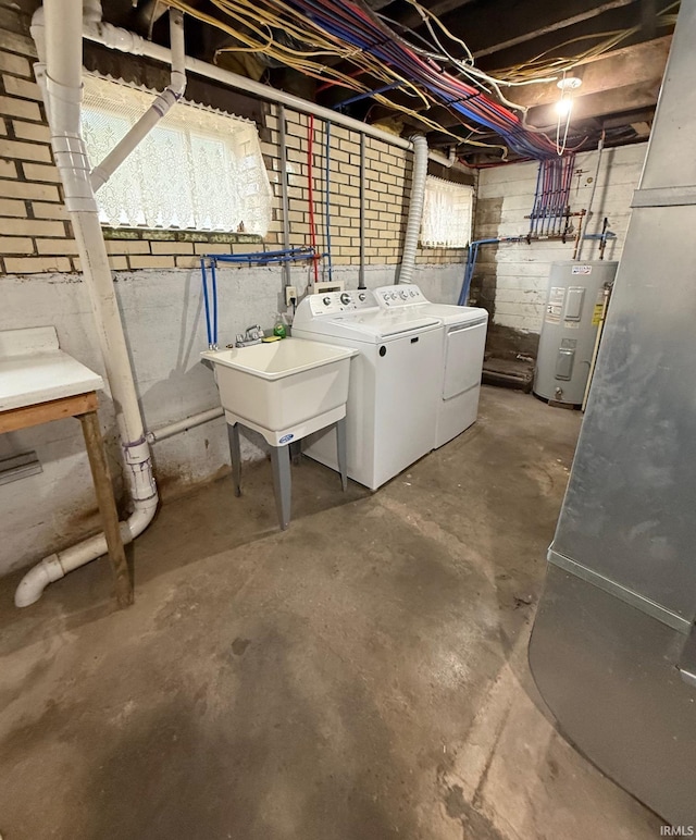 110 W Elnora St, Odon, IN 47562 - below grade area with water heater, washer and dryer, and a sink