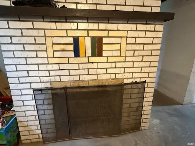 110 W Elnora St, Odon, IN 47562 - detailed view of unfinished concrete flooring and a fireplace