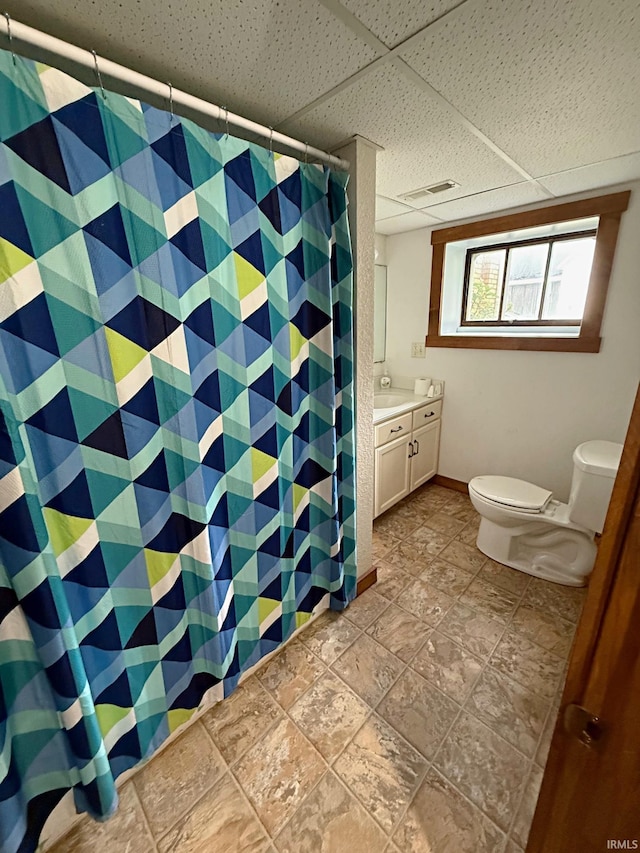 110 W Elnora St, Odon, IN 47562 - bathroom featuring toilet, vanity, a shower with curtain, and a paneled ceiling