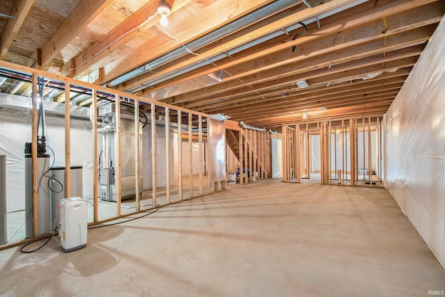 unfinished basement with a water softener system