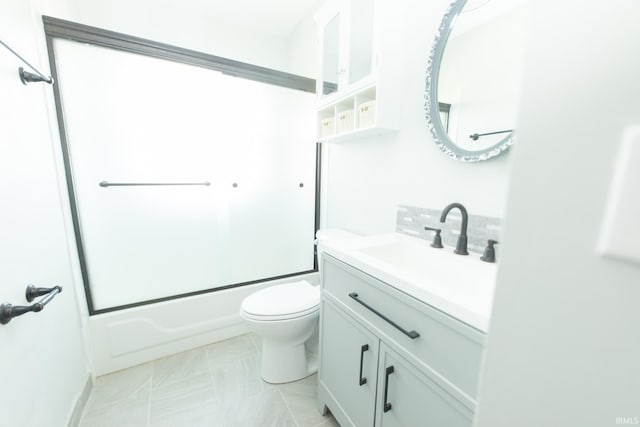 bathroom with vanity, shower / tub combination, and toilet