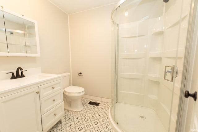 full bathroom with a shower stall, toilet, vanity, and baseboards