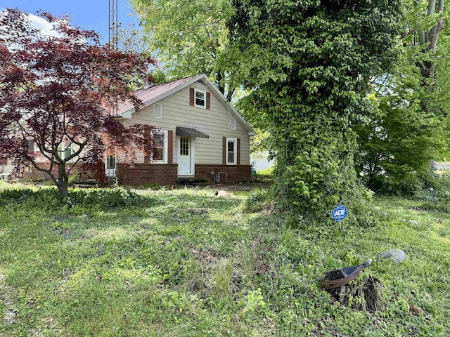 219 W Boone St, Gentryville, IN 47537 - view of front of house featuring brick siding