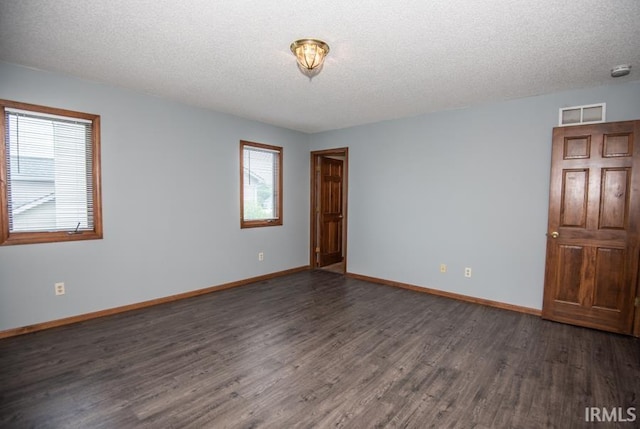 10217 Lake Tahoe Ct, Fort Wayne, IN 46804 - empty room with wood finished floors, baseboards, a textured ceiling, and a smoke detector