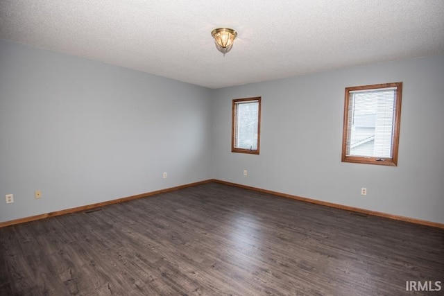 10217 Lake Tahoe Ct, Fort Wayne, IN 46804 - empty room featuring healthy amount of natural light, wood finished floors, baseboards, and a textured ceiling
