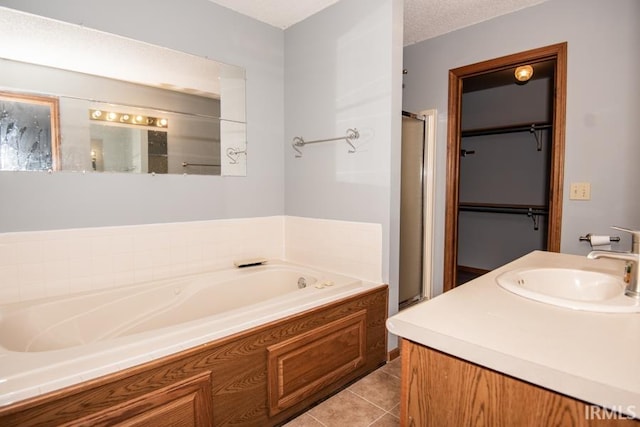 10217 Lake Tahoe Ct, Fort Wayne, IN 46804 - full bath featuring a shower stall, a bath, tile patterned floors, and vanity