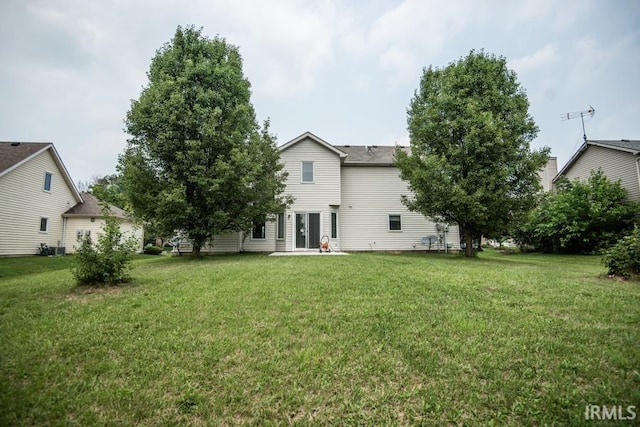 10217 Lake Tahoe Ct, Fort Wayne, IN 46804 - back of property featuring a yard, central AC, and a patio area