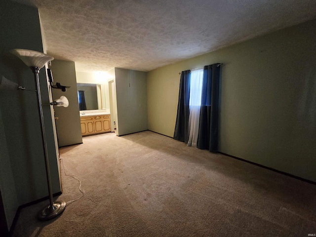 4980 W 200 N, Kokomo, IN 46901 - unfurnished bedroom with light colored carpet, a textured ceiling, and ensuite bath
