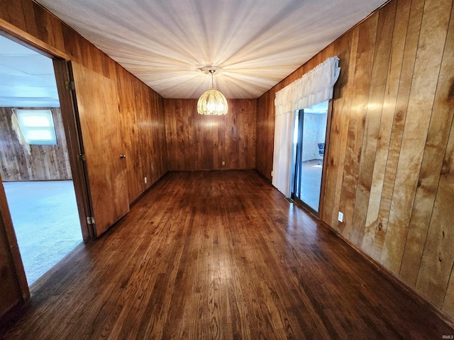 4980 W 200 N, Kokomo, IN 46901 - unfurnished room with a chandelier, dark wood finished floors, and wooden walls