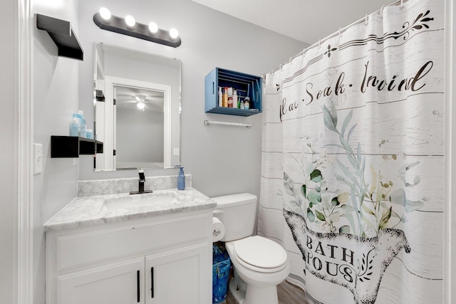 13726 Hamilton Meadows Ln, Fort Wayne, IN 46814 - bathroom with toilet, vanity, curtained shower, and a ceiling fan
