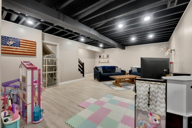 13726 Hamilton Meadows Ln, Fort Wayne, IN 46814 - playroom with wood finished floors and baseboards