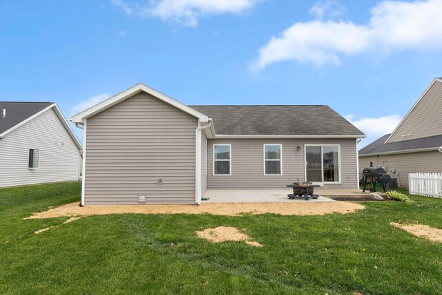 13726 Hamilton Meadows Ln, Fort Wayne, IN 46814 - back of house with a patio, a yard, and a shingled roof