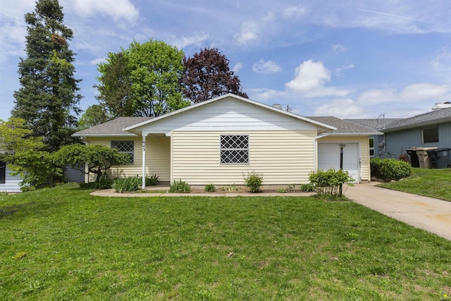 ranch-style house with concrete driveway, a front yard, and an attached garage