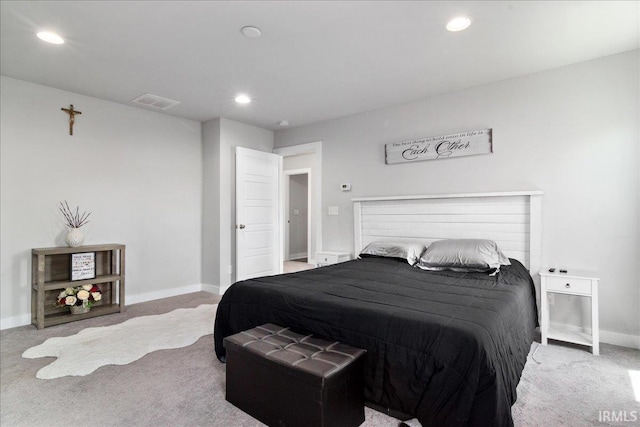 carpeted bedroom featuring recessed lighting and baseboards