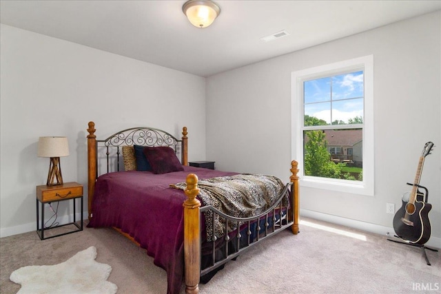 bedroom featuring carpet floors and baseboards