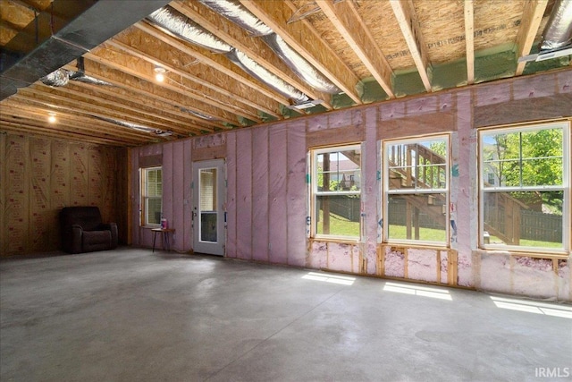 miscellaneous room with concrete flooring and healthy amount of natural light