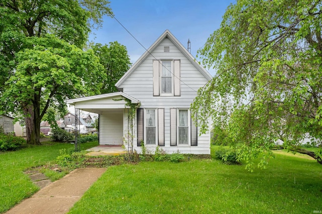 rear view of house with a lawn