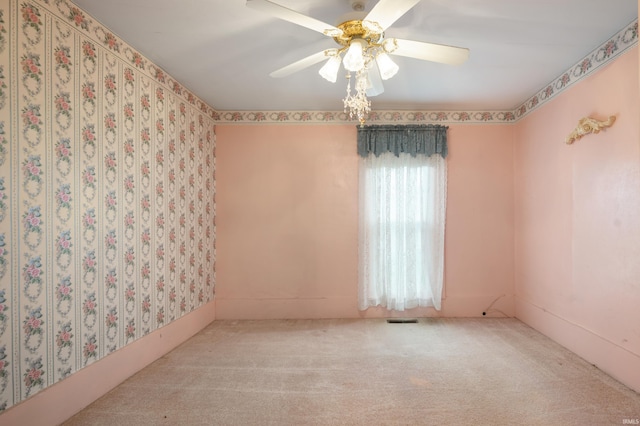 carpeted empty room with ceiling fan