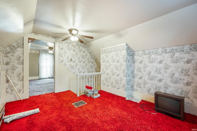 bonus room with ceiling fan, vaulted ceiling, and carpet floors
