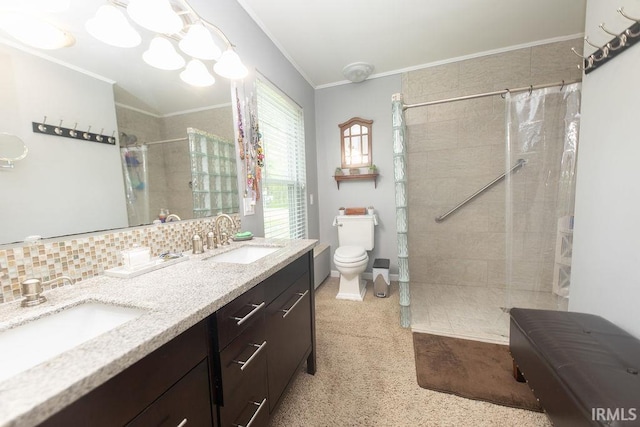 12067 E Bedrock Ln, Springville, IN 47462 - bathroom featuring tiled shower, crown molding, toilet, double vanity, and tasteful backsplash