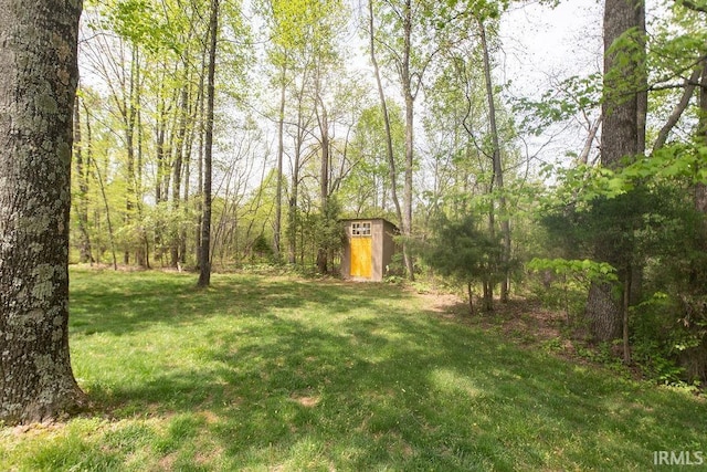 12067 E Bedrock Ln, Springville, IN 47462 - view of green lawn featuring a wooded view