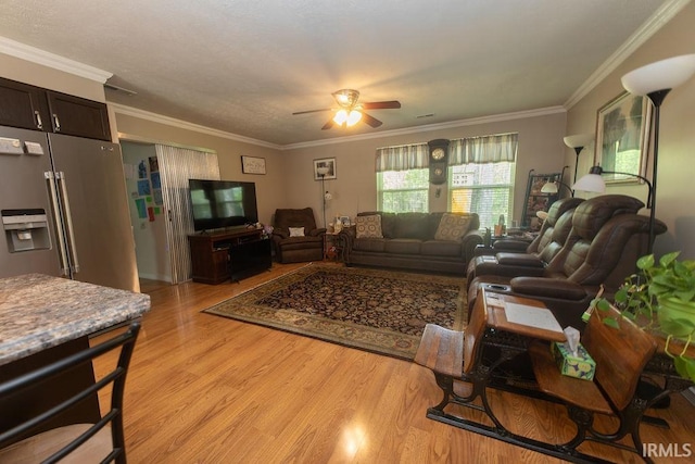12067 E Bedrock Ln, Springville, IN 47462 - living room featuring a ceiling fan, light wood finished floors, and crown molding