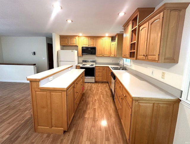 kitchen featuring white appliances, a sink, light wood-style flooring, open shelves, and recessed lighting