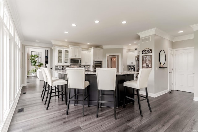 dining space with dark wood-style floors, recessed lighting, and baseboards