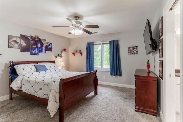 bedroom featuring carpet flooring, baseboards, and a ceiling fan
