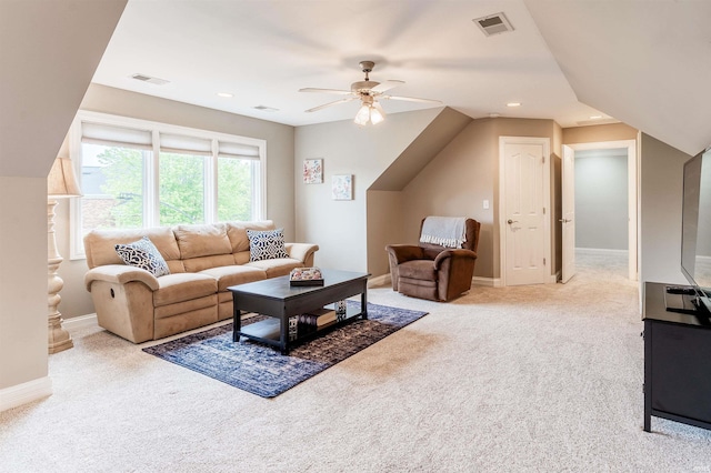 carpeted living area with a ceiling fan, lofted ceiling, and baseboards