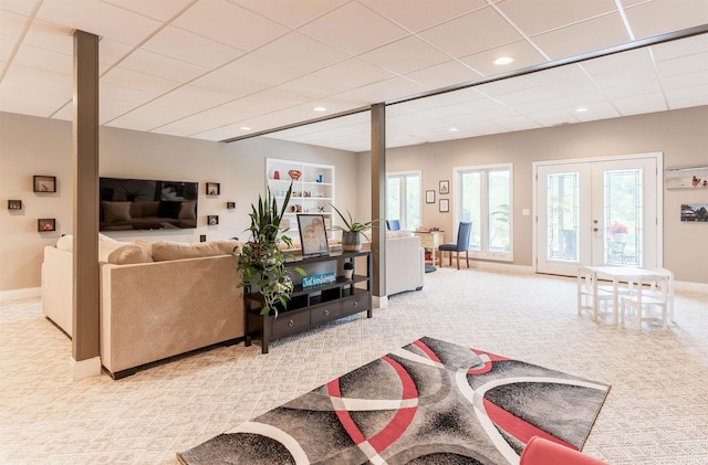 living room with light colored carpet, baseboards, french doors, and recessed lighting