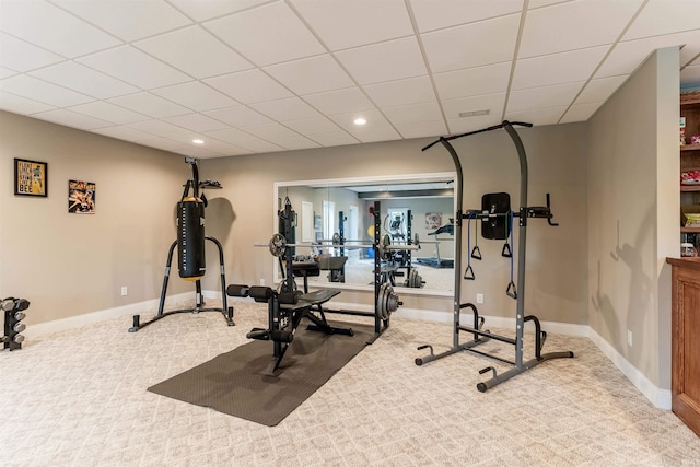 workout room featuring carpet, a drop ceiling, baseboards, and recessed lighting