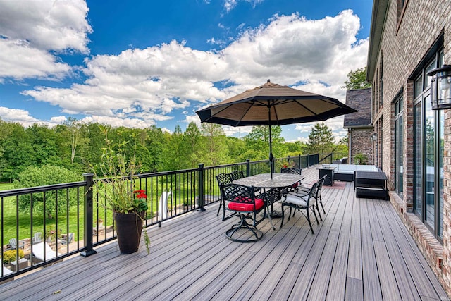 wooden terrace with outdoor lounge area and outdoor dining area