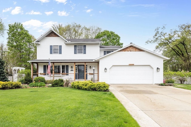 view of front of home featuring a porch, an attached garage, a front yard, and concrete driveway