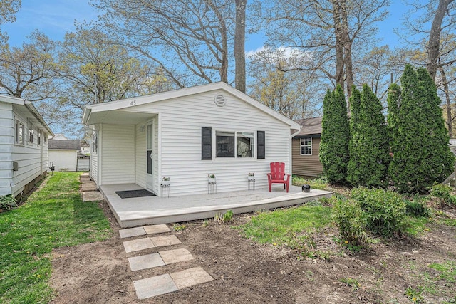 back of property featuring a wooden deck