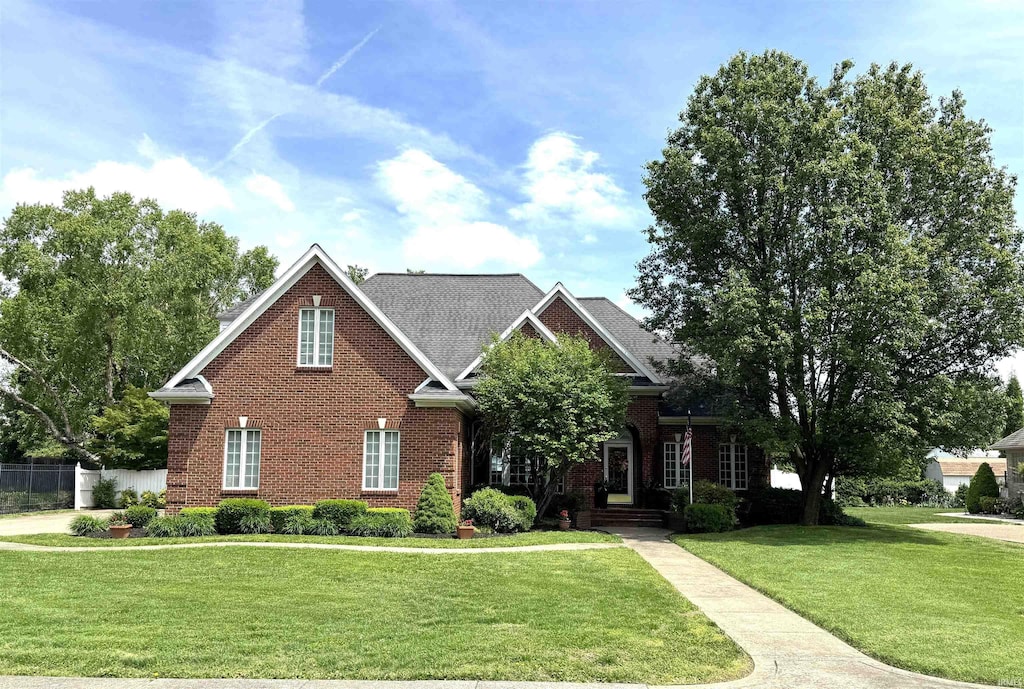 504 Sandalwood Dr, Evansville, IN 47715 - view of front of property featuring brick siding and a front lawn