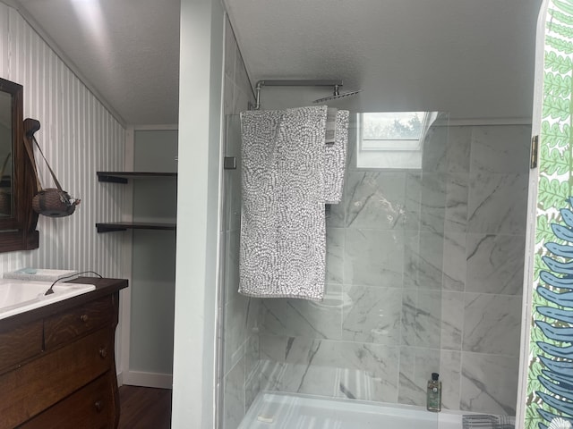 2515 Hubertus Ave, Fort Wayne, IN 46805 - bathroom featuring a shower, vanity, and a textured ceiling