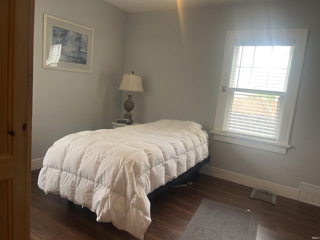 2515 Hubertus Ave, Fort Wayne, IN 46805 - bedroom featuring baseboards and dark wood-style floors