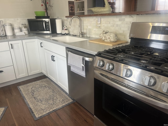 2515 Hubertus Ave, Fort Wayne, IN 46805 - kitchen with stainless steel appliances, a sink, dark wood-style flooring, and white cabinetry