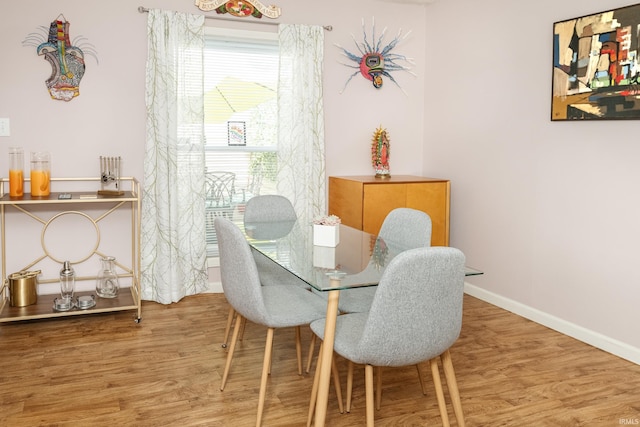 1005 E Buckingham Dr, Bloomington, IN 47401 - dining space with wood finished floors and baseboards