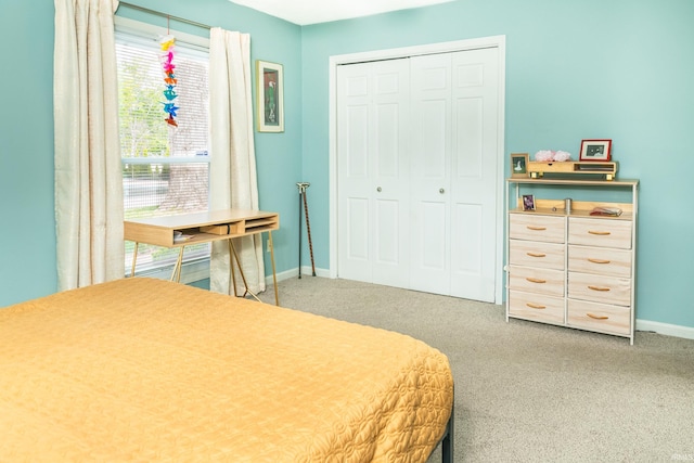 1005 E Buckingham Dr, Bloomington, IN 47401 - carpeted bedroom featuring baseboards and a closet