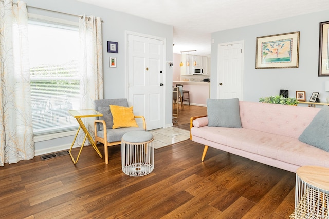 1005 E Buckingham Dr, Bloomington, IN 47401 - living area with wood finished floors and baseboards