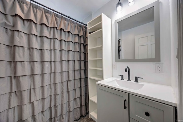 full bath featuring vanity and curtained shower
